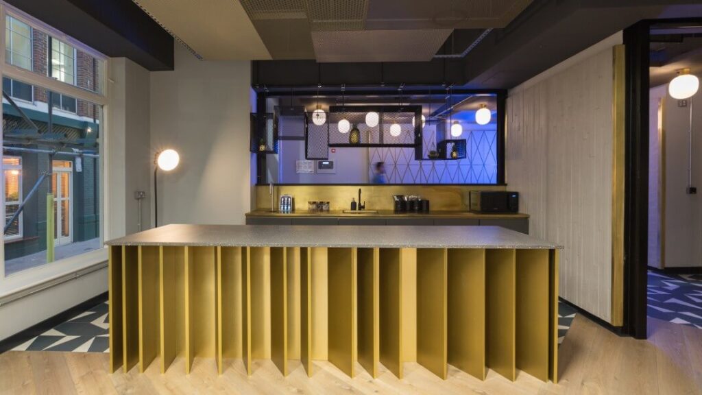 TBWC Carter Lane breakout kitchen with brass bar counter and pendant lighting