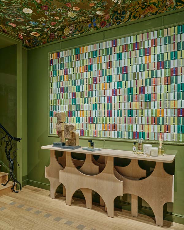 Diptyque Bond Street till point beneath the boutique's floral ceiling mural