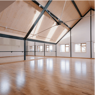 Glyndebourne Production Hub rehearsal studio with sprung floor and mirrored wall