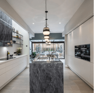 Chelsea Townhouse Development kitchen with marble island and pendant lighting